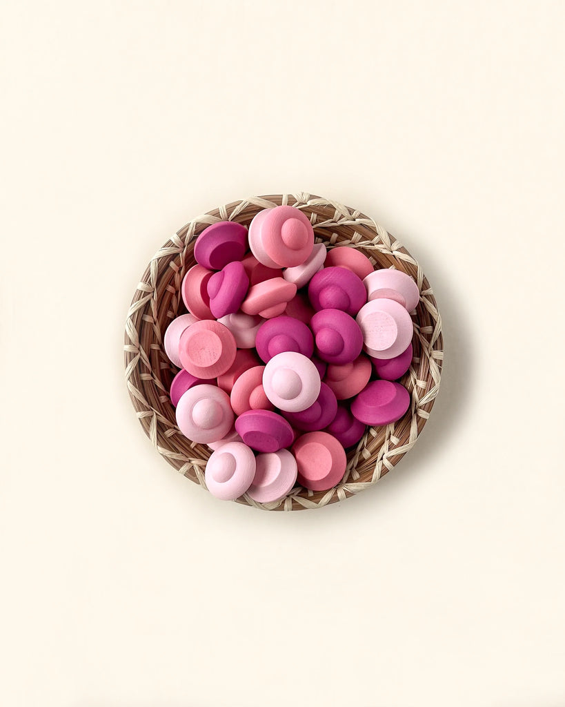 A Grapat Mandala Flower filled with various shades of pink and purple flower buttons, neatly arranged on a soft beige background.