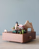 Wooden music box with the theme of a Western town and a train going around