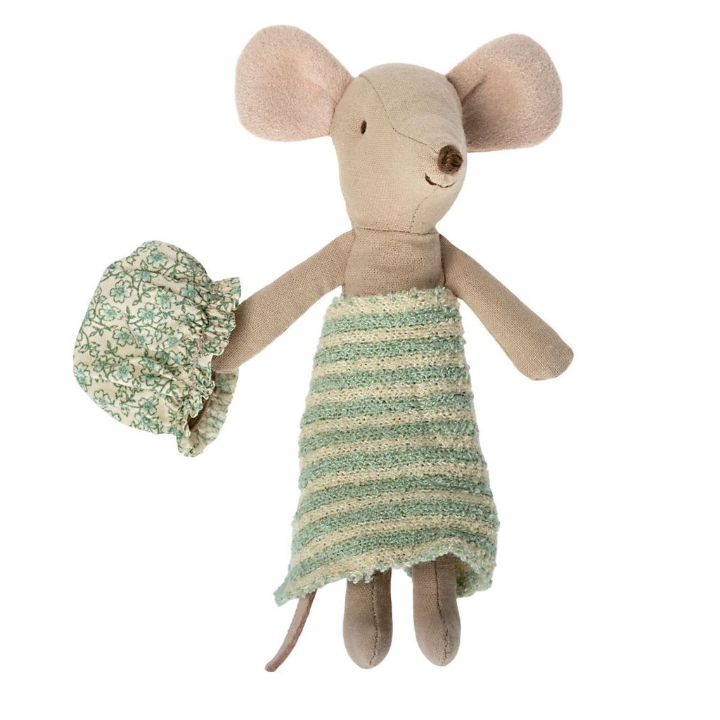A Maileg Wellness Mouse, Big Sister (Mint) dressed in a green and beige striped dress, holding a small floral patterned handbag, dubbed Ms. Mouse, isolated on a white background.