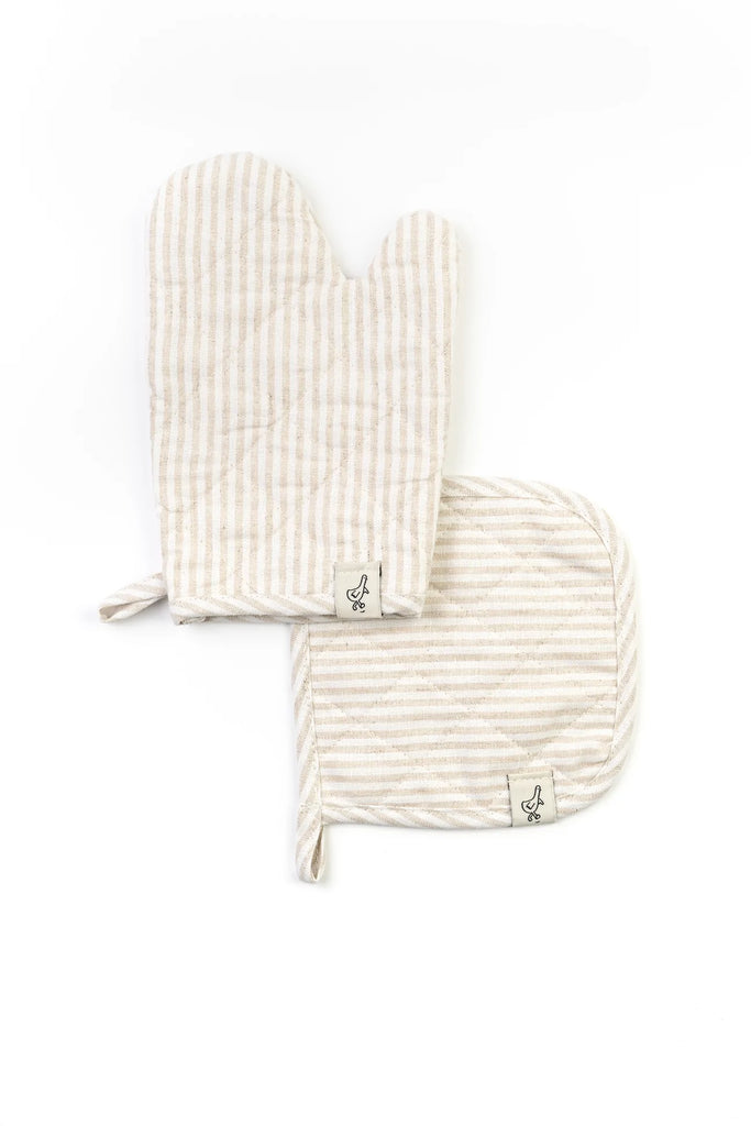 An Play Oven Mitt Set and a pot holder with matching beige and white stripes, both featuring a small logo with what appears to be a stylized "a" on a white background, ideal for little chefs.