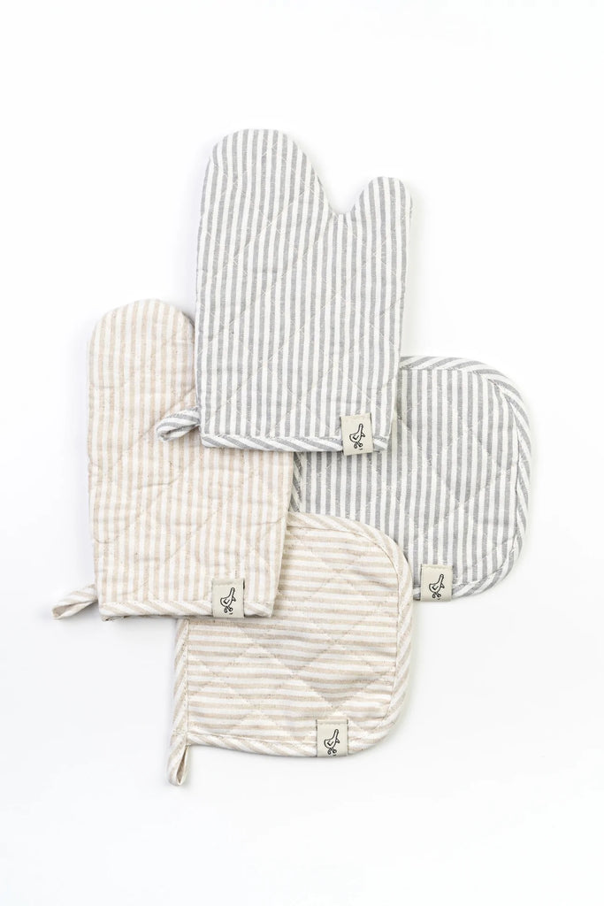 Four striped Play Oven Mitt Sets and potholders in neutral colors, each featuring a small embroidered emblem, arranged overlapping each other on a white background.