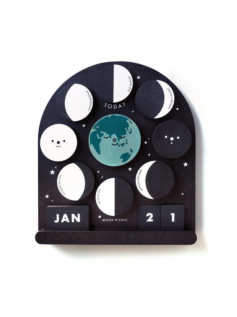 A Me & The Moon - Moon Phase Calendar shaped like a window, featuring a celestial theme. Dates displayed are January 21st, with decorative elements like stars, a magnetic moon disc, and Earth.