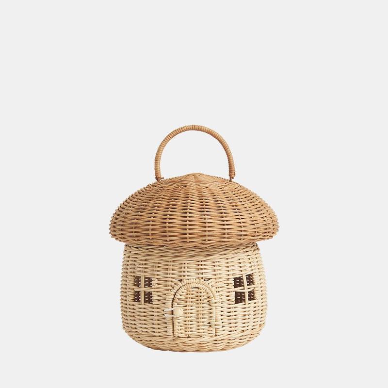 A natural rattan mushroom basket with a white background. Two windows and door. 