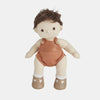 A small, cuddly Olli Ella Dinkum Doll with brown hair, wearing an orange jumper and beige shoes with white socks, posing against a white background.