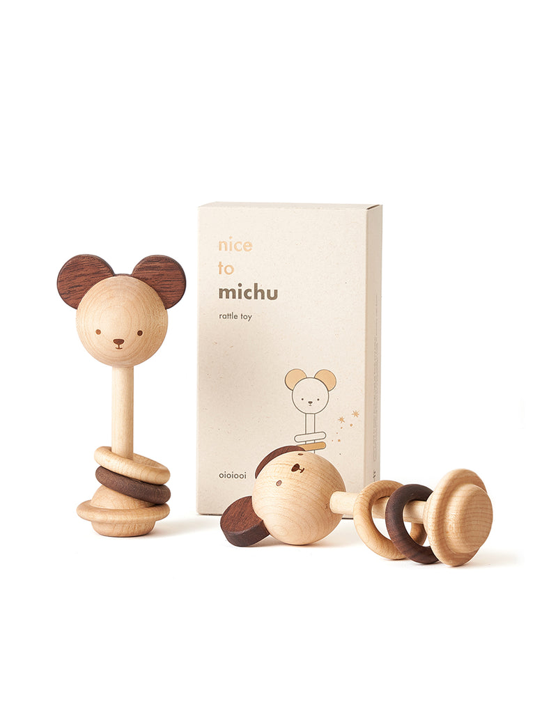 A wooden Nice to Michu Baby Rattle shaped like a mouse with eco-friendly packaging, labeled "nice to michu" on a white background.