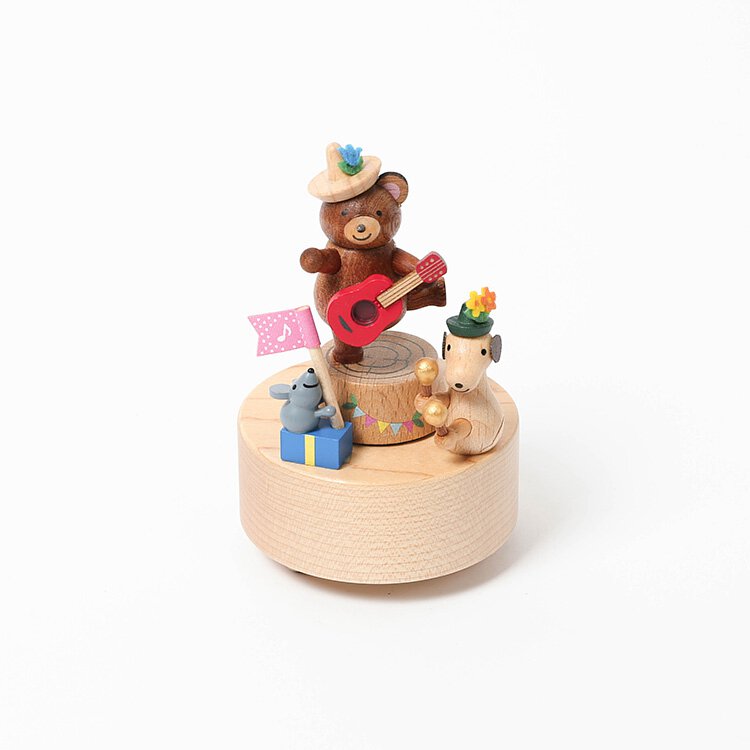 A Mini Wooden Party Music Box hand-cranked music box made from sustainably sourced wood, featuring a bear playing a guitar with a small mouse, hedgehog, and decorative elements like flags and a birthday