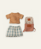 An overhead view of Maileg Extra Clothing: Clothes & Bag for Big Sister - Old Rose, featuring a striped orange and white t-shirt, a green and white checkered skirt, and a floral backpack with tan accents.