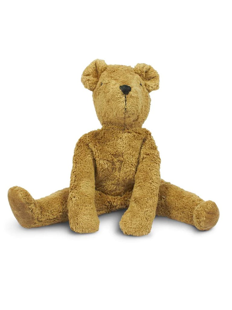 A well-worn Senger Naturwelt Stuffed Animal - Bear with a button nose, sitting upright on a white background, showing signs of being loved and cuddled often.