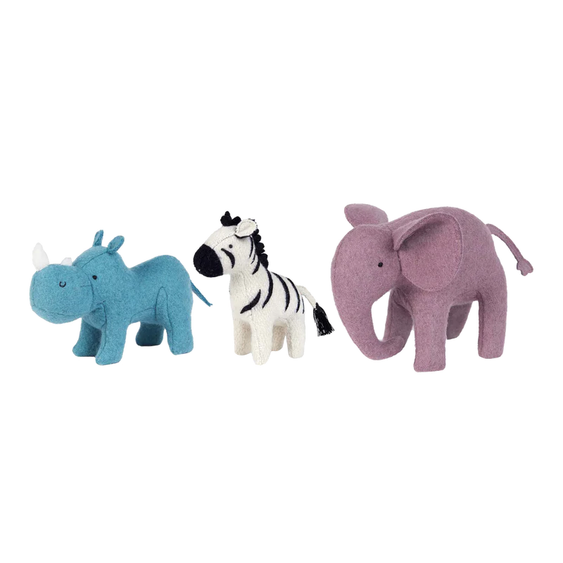 A line of three Olli Ella Holdie Folk Felt Safari Animals including a blue unicorn, a white and black zebra, and a purple elephant on a translucent background, perfect for imaginative play.
