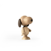 A Boyhood Snoopy, Small figurine with large, round eyes and prominent ears, standing upright and facing left, set against a soft gray and white background.