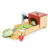 A Tortoise Pet Set featuring a tortoise with a retractable head and a cozy home with a green sliding door, alongside a red strawberry accessory on a white background.