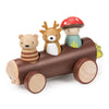 A Timber Taxi, carrying three Merrywood folks figurines: a bear, a deer, and a mushroom-headed character, against a white background.