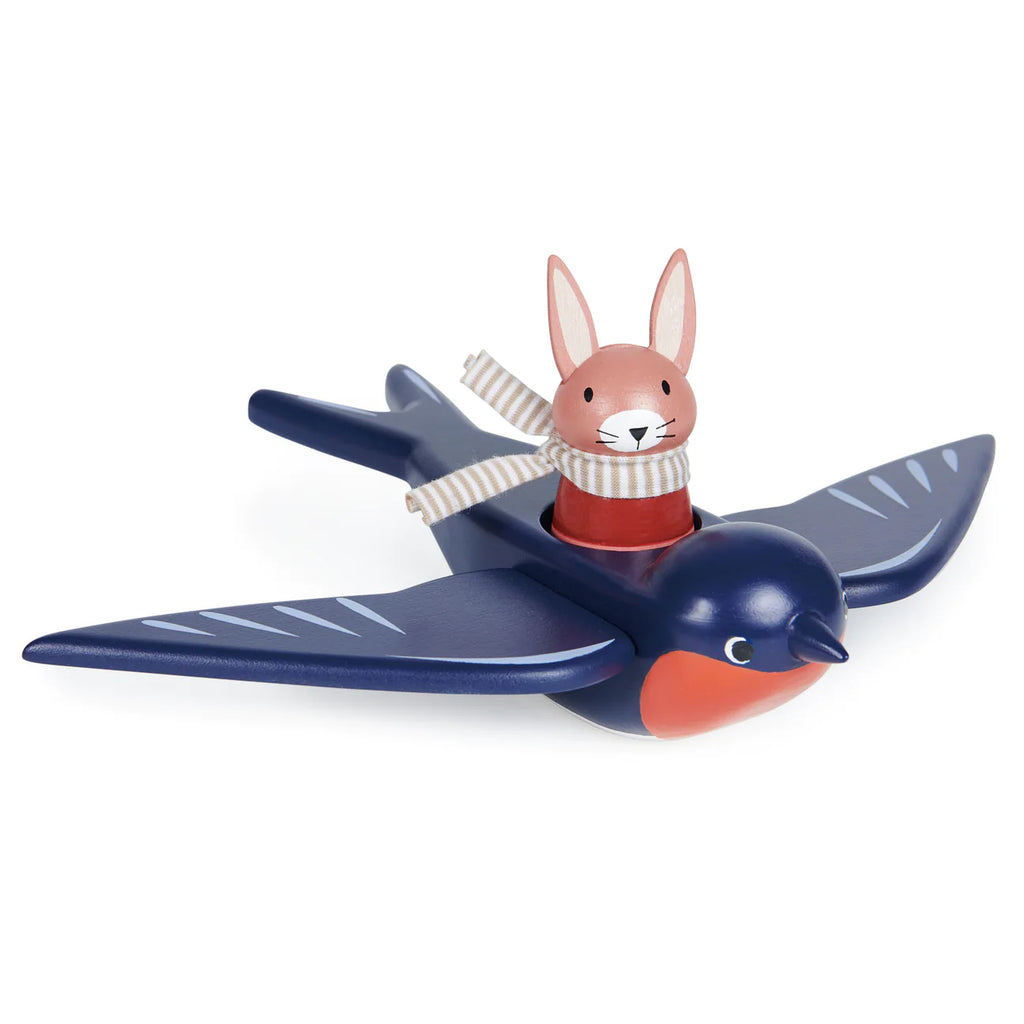 A toy featuring Swifty Bird the pilot Hare riding a stylized blue airplane with gray wings, red details, and the letter "c" on the front. Swifty Bird wears a scarf and pilot goggles.