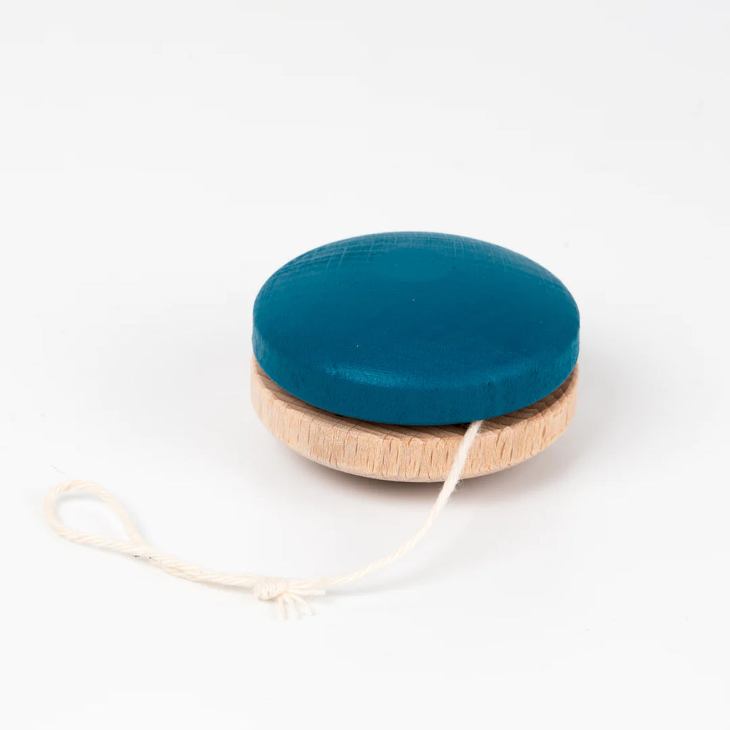 A traditional blue Wooden Yoyo, painted and featuring a natural beech wood edge with a white string, isolated on a white background.
