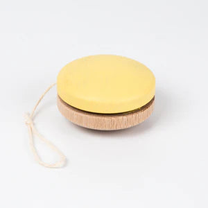 A round, two-toned Wooden Yoyo with a yellow painted top and natural beech wood bottom, attached to a white string, displayed against a plain white background.