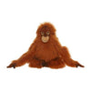 A Orangutan Stuffed Animal with realistic features and fluffy orange fur, sitting with its arms and legs spread out, displayed against a white background.