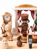 Nutcracker Ballet Music Box arranged in a display, crafted from sustainably sourced wood, featuring a mouse with a shield, a bearded soldier, and other figurines under an archway, demonstrating intricate craft details.