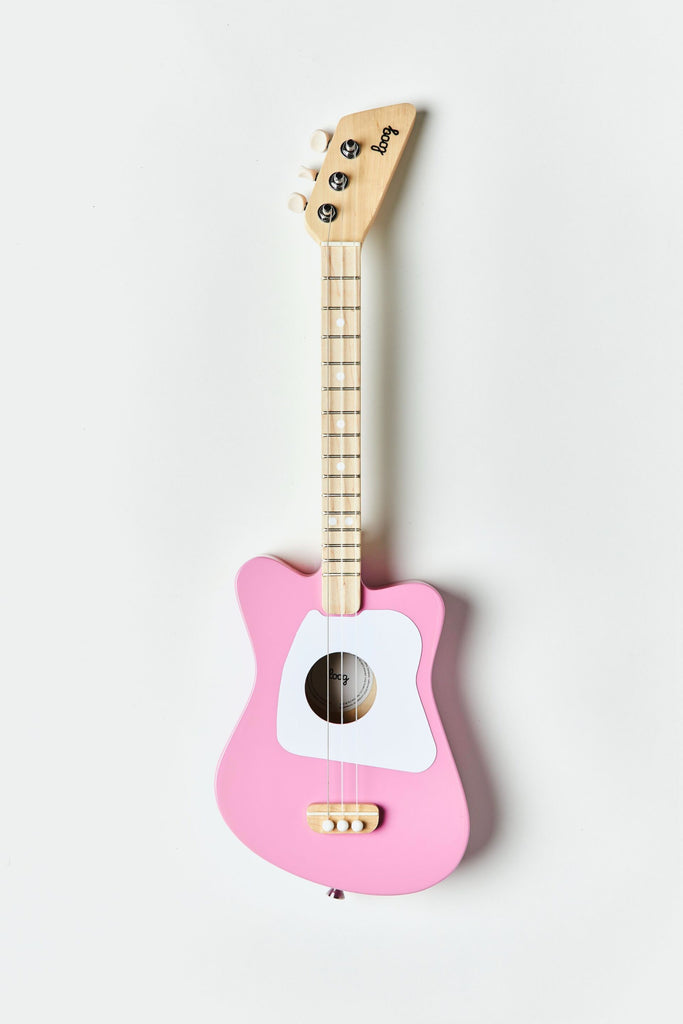A wooden kid's guitar painted in pink and white.