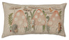 Decorative Coral & Tusk Mushroom Forest Pocket Pillow with an embroidered design featuring three whimsical mushroom houses, adorned with small birds, foliage, and animals including a foraging chipmunk and a hedgehog.