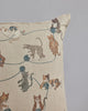 A beige embroidered Coral & Tusk Playful Cats Pillow with a design featuring various playful Siamese cats interacting with balls of yarn on a simple gray background.