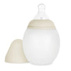 A beige and white Medical Grade Silicone Baby Bottle with a soft silicone body and a detachable nipple cover, designed to mimic breastfeeding, isolated on a white background.