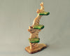 A Handmade Wooden Bird Tree sculpture with a curved trunk and circular green-painted leaves on a light gray background.