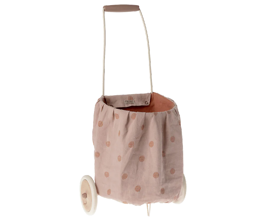 The Maileg Trolley, Multi dots - Rose is a children’s toy shopping trolley with a washable pink polka dot linen bag, wooden wheels, and handle.