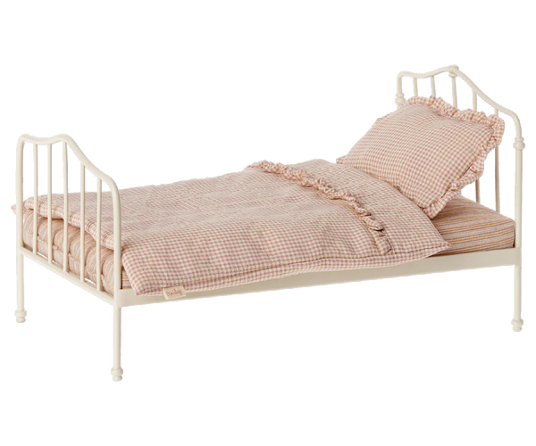 Toy pink doll bed
