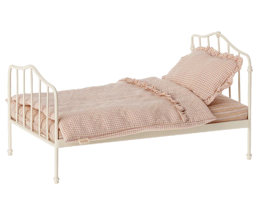 Toy pink doll bed