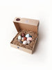Wooden egg toys in a peper nest