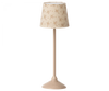 A cream-colored Maileg Miniature Floor Lamp - Tall with a cylindrical shade decorated with small, delicate floral patterns, standing on a sleek, matching base.