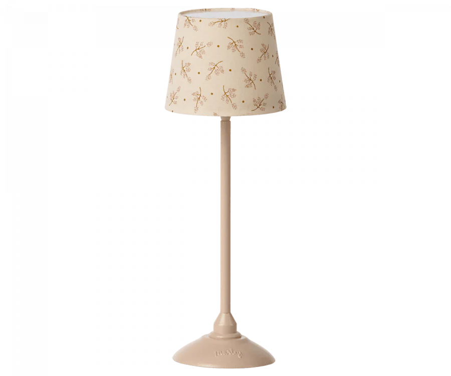 A cream-colored Maileg Miniature Floor Lamp - Tall with a cylindrical shade decorated with small, delicate floral patterns, standing on a sleek, matching base.