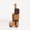Ultimate Wooden Alphabet Puzzle shaped like a giraffe riding on a little truck, set against a plain white background. The giraffe's long neck forms the top part of the stack, with body pieces.