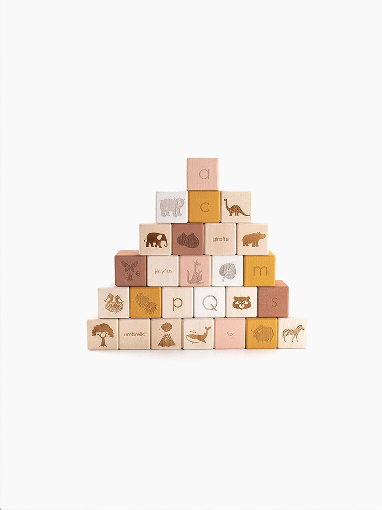A pyramid of Alphabet Wooden Blocks - Rose made from linden wood, each with a letter and corresponding animal illustration painted with non-toxic paint, against a white background.