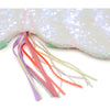 A close-up image of a shiny pink iridescent sequin fabric with multi-colored ribbons extending from the edge on a white background Meri Meri Winged Unicorn Costume.